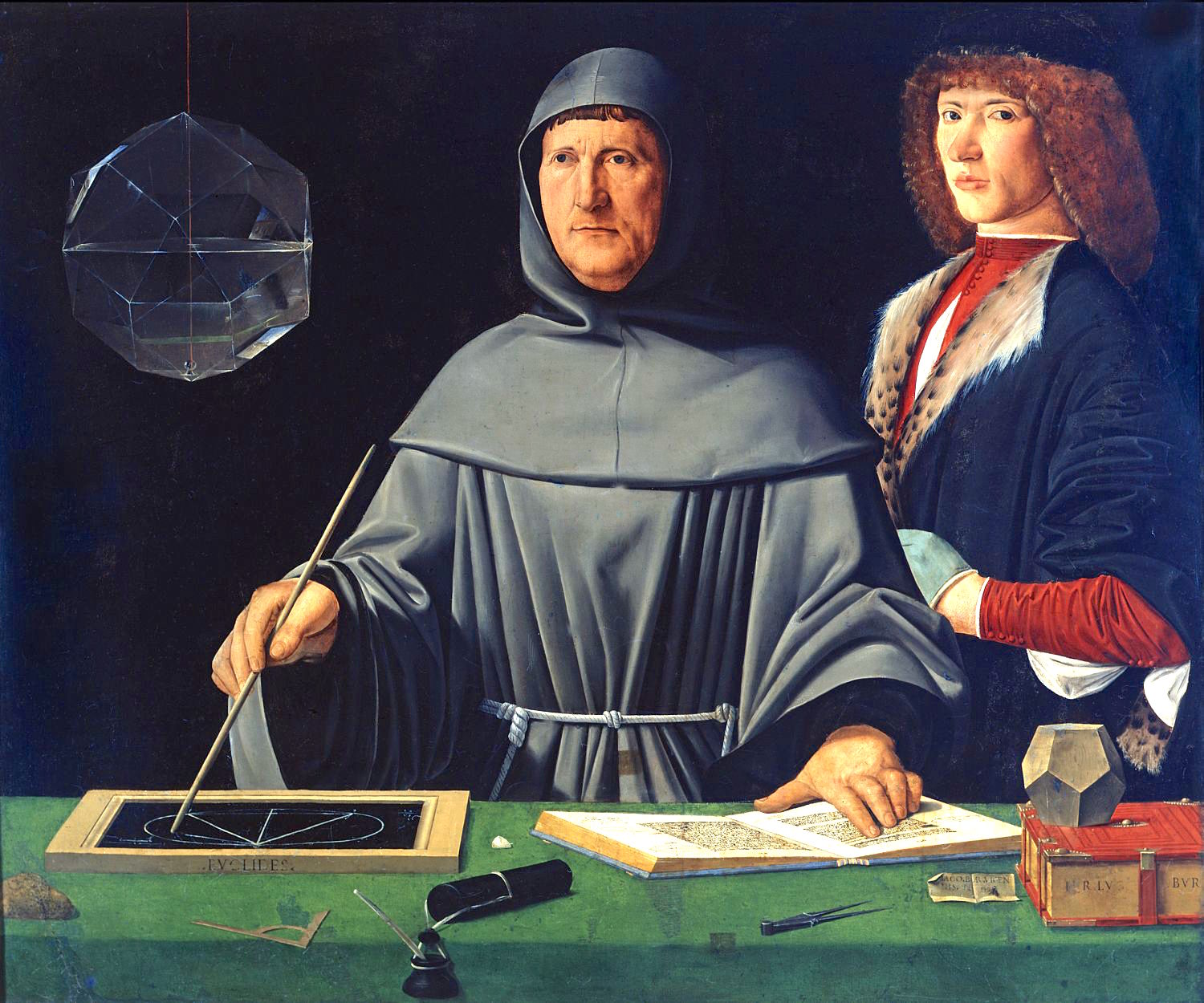 Portrait of Luca Pacioli, attributed to Jacopo de’ Barbari (d. c. 1516). Pacioli, wearing a monk's habit, is placed centrally, standing at a table. He is consulting an open book, apparently one of the volumes of Euclid's ‘Elements’, and is drawing on a slate the diagram for Proposition XIII.12, part of the construction of a regular tetrahedron. A glass rhombicuboctahedron, half-full of water, hangs behind Pacioli; a small dodecahedron sits on top of a closed book on the table.